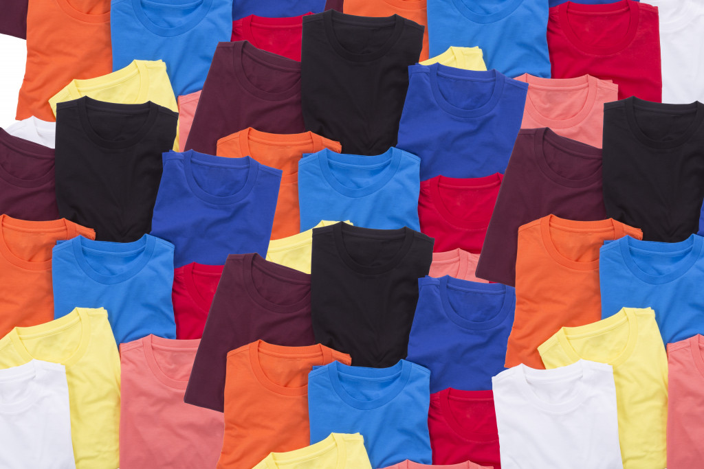 Colorful T-shirts folded background